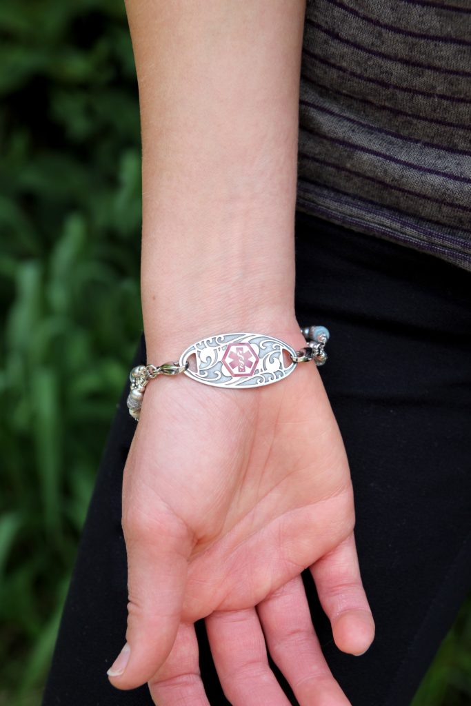 blood thinner medical ID tag attached to med ID bracelet shown on wrist